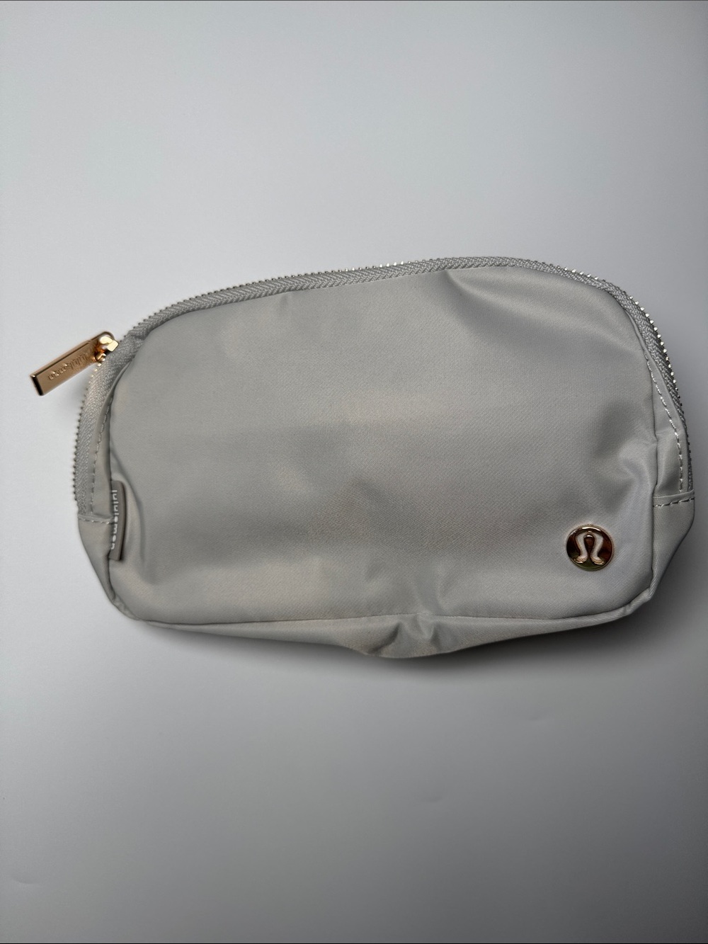 lululemon athletica Light Gray Belt Bag with White & Gold Accent Strap